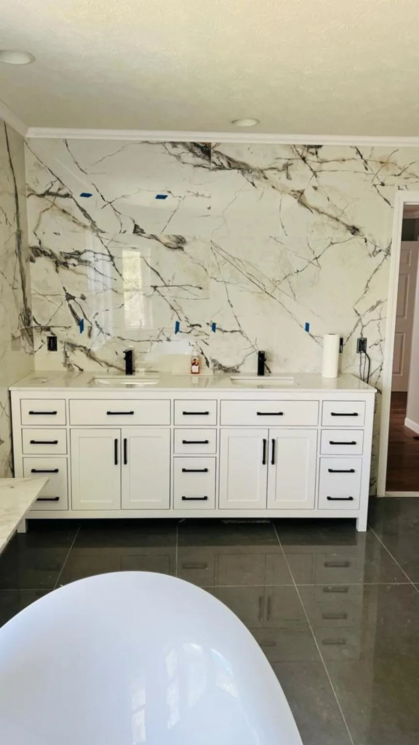 Custom double vanity and full height wall tile