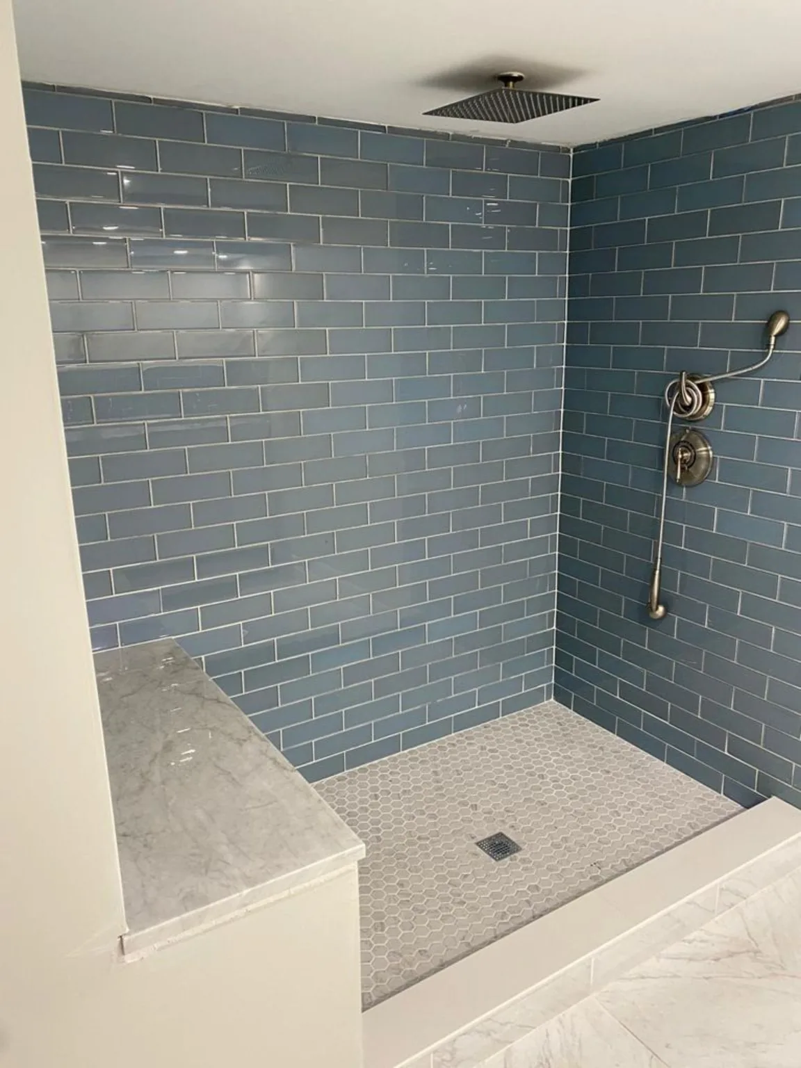 Blue tile shower before glass installation